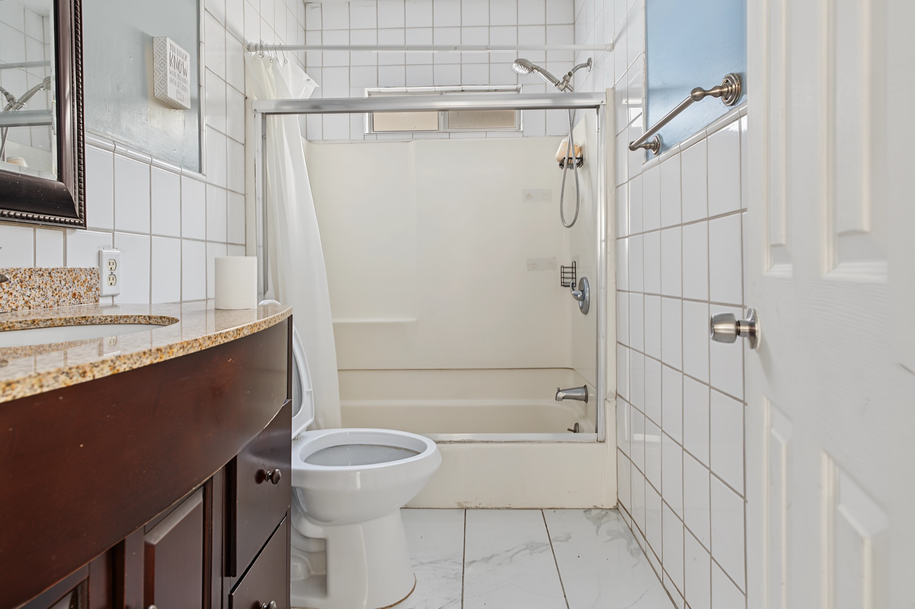 Bathroom with tiled shower and vanity at 2829 S Rimpau