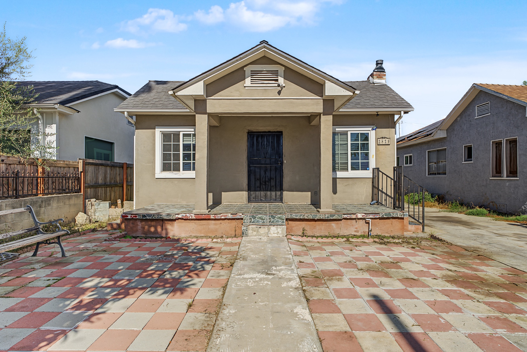 Front exterior and porch of 2829 South Rimpau Boulevard in Los Angeles